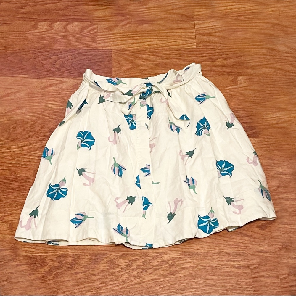 White skirt with blue flowers